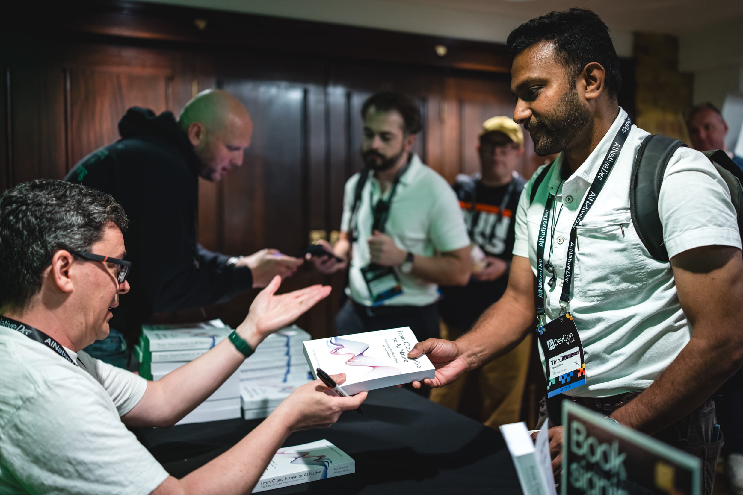 Pini Reznik signing copies of From Cloud Native to AI Native