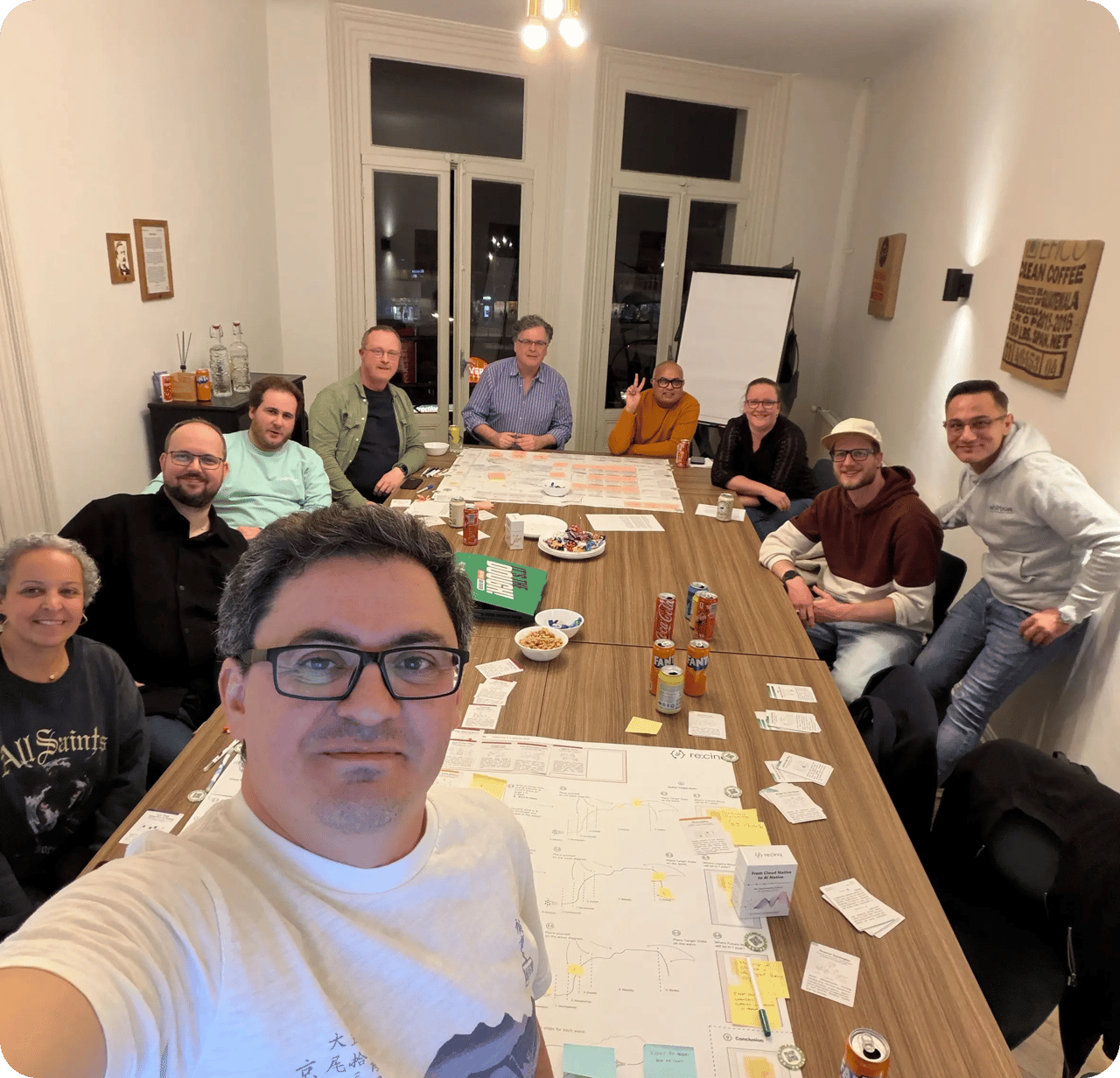 Workshop attendees collaborating around the AI Native pattern cards canvas