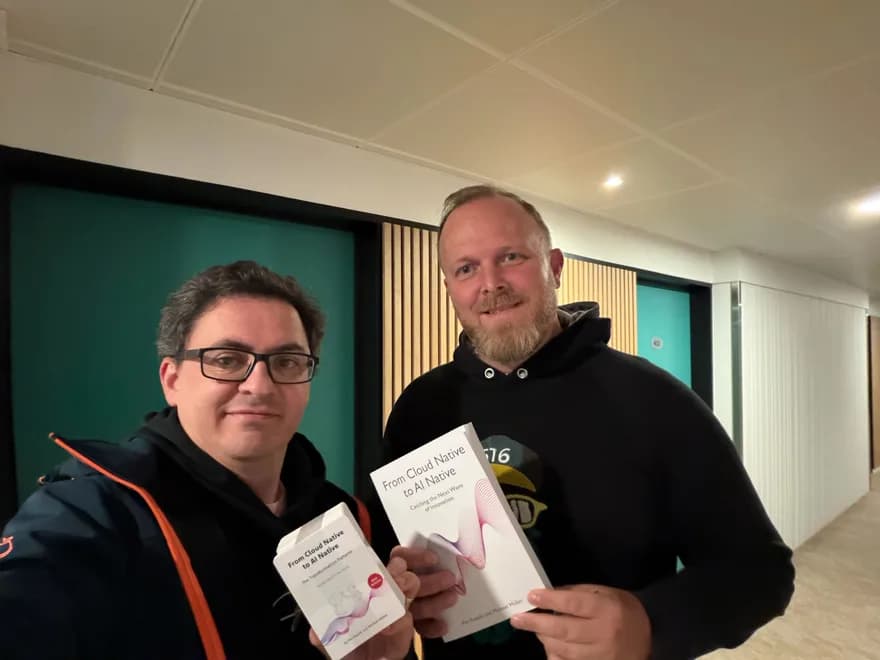 re:cinq engineers holding the From Cloud Native to AI Native book
