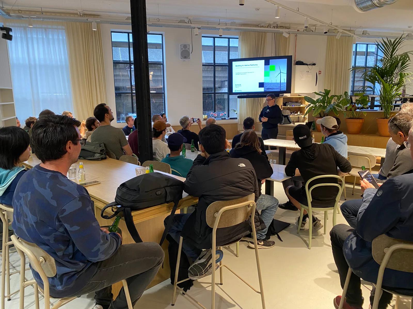 Pini Reznik giving the opening talk at the first AI Native Netherlands meetup at Vandebron, May 2025.